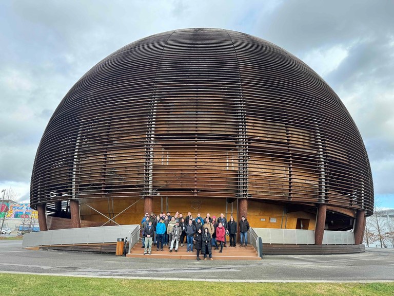 Group photo in front of the Globe of Science and Innovation